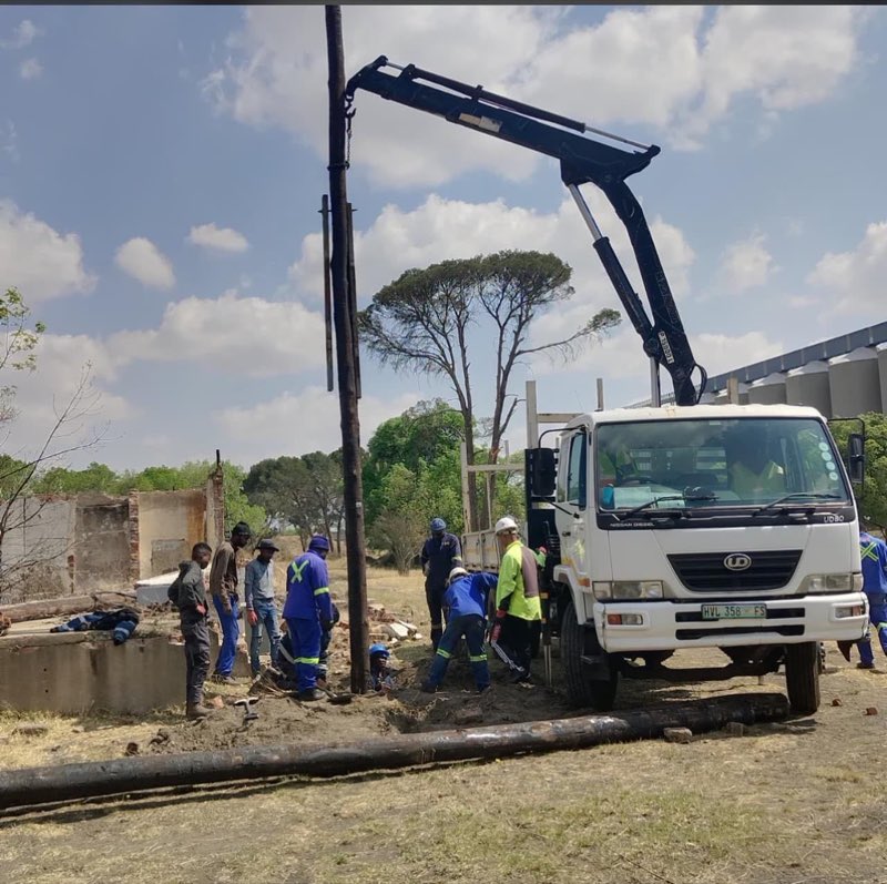 Construction site with engineers discussing plans